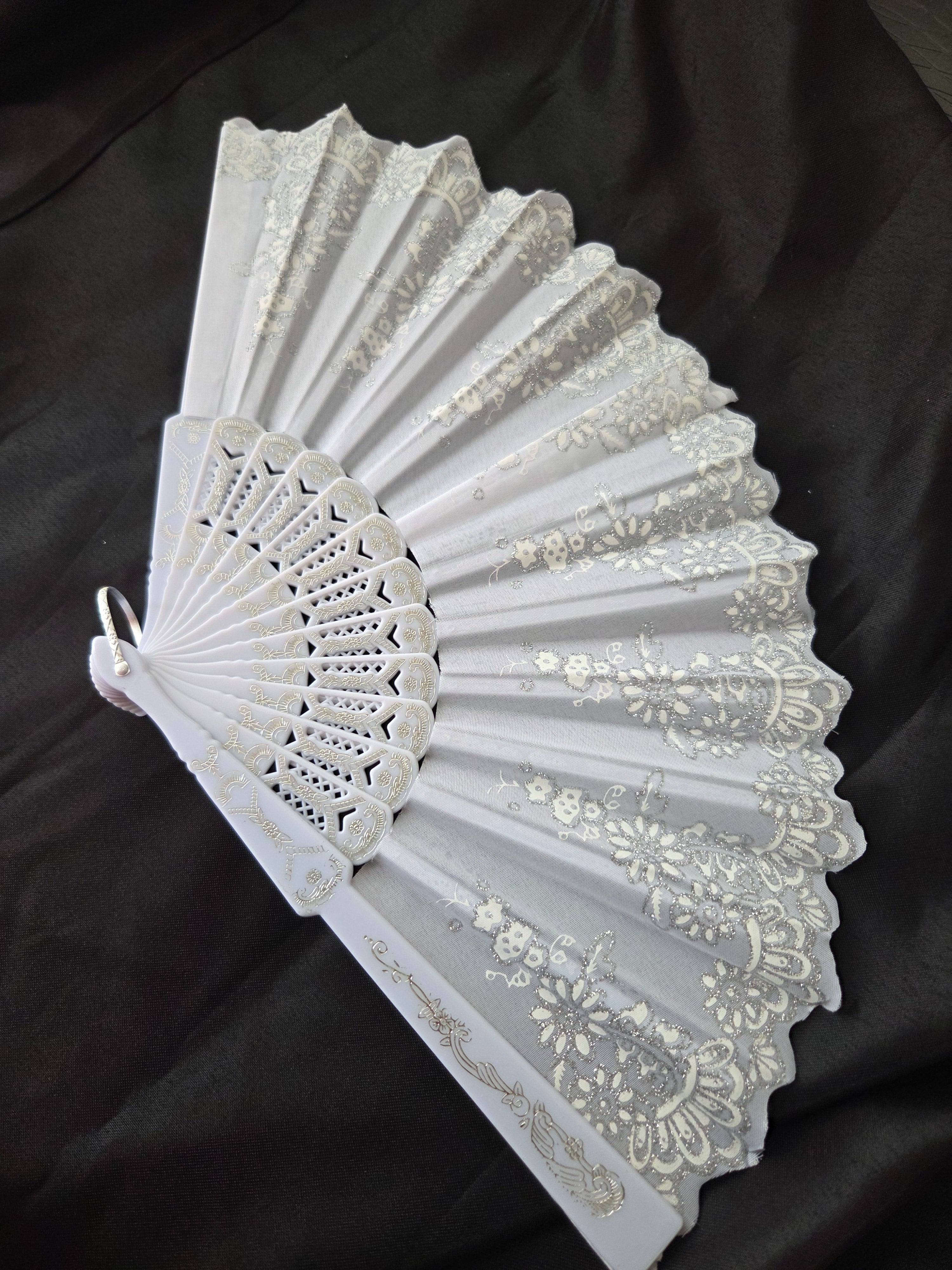Beautiful hand held fan with glitter designs